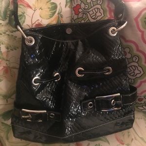 Black pocketbook. Barely used! Very sassy!